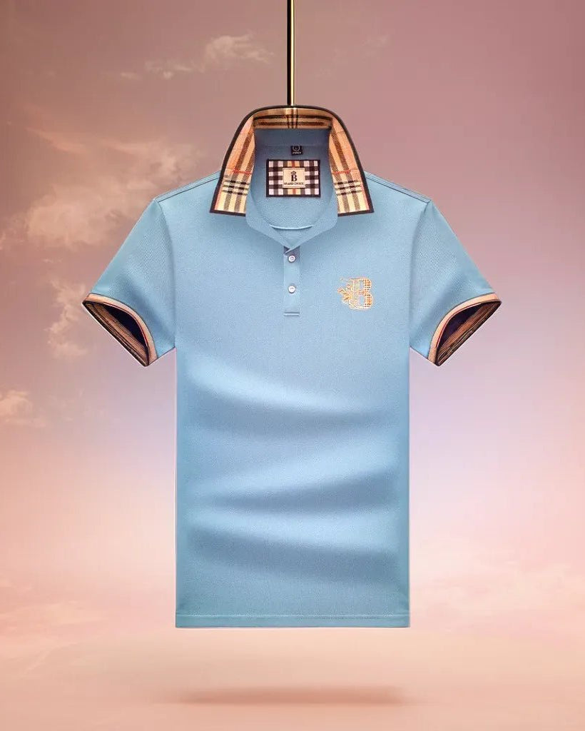 Light blue polo shirt with plaid collar and brand logo on a gradient background