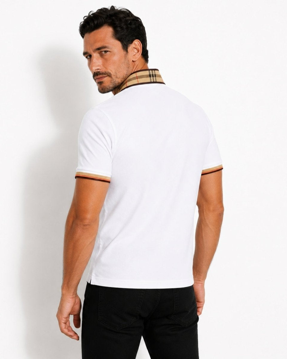 Man wearing a white polo shirt with a checkered collar against a plain background