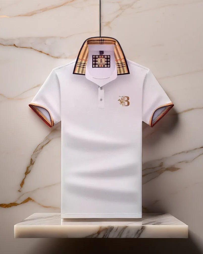 White polo shirt with plaid collar and brand logo on a marble surface
