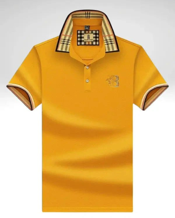 Yellow polo shirt with a brand logo on a light gray background