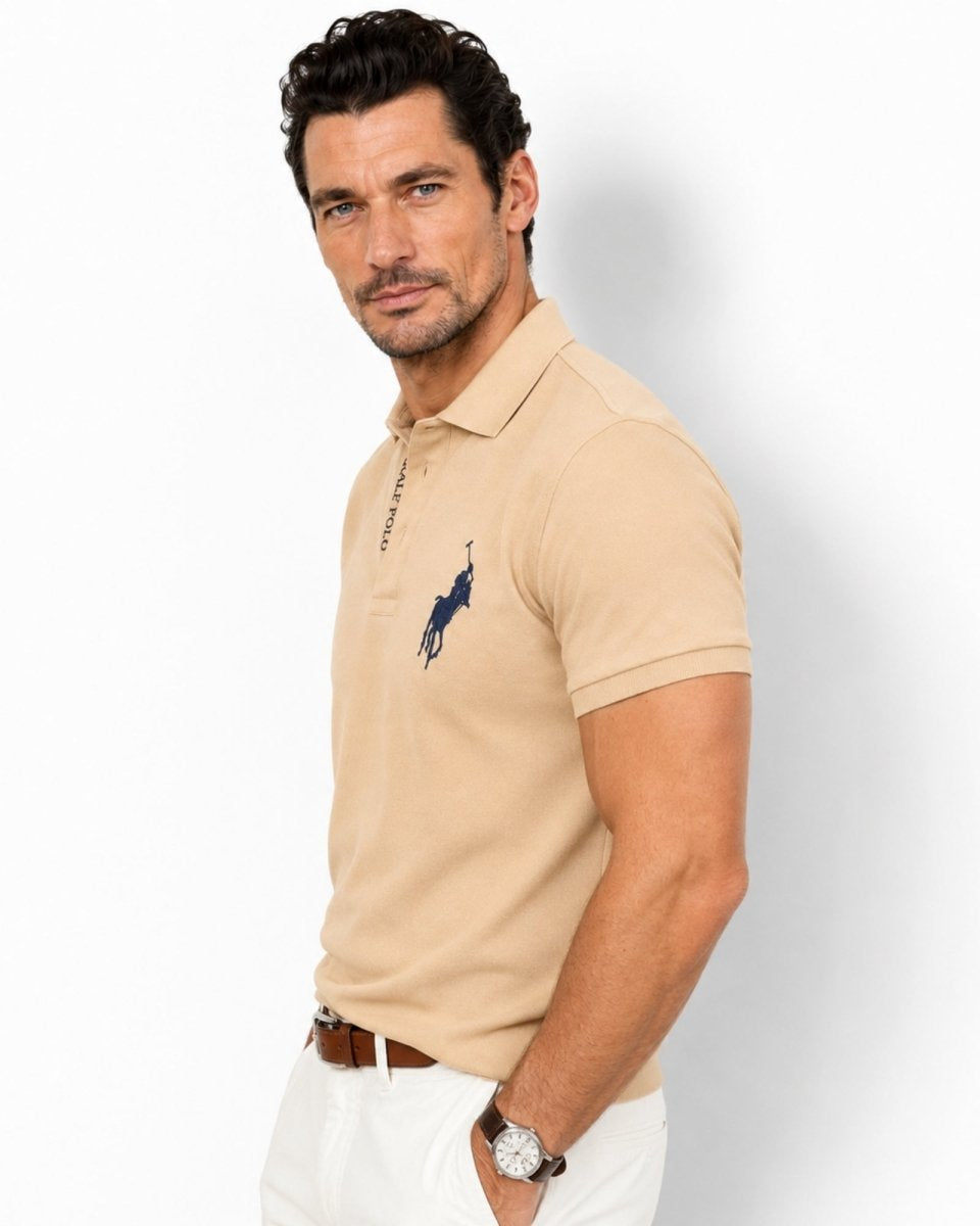 Man wearing a beige Polo Ralph Lauren shirt with a logo on a white background