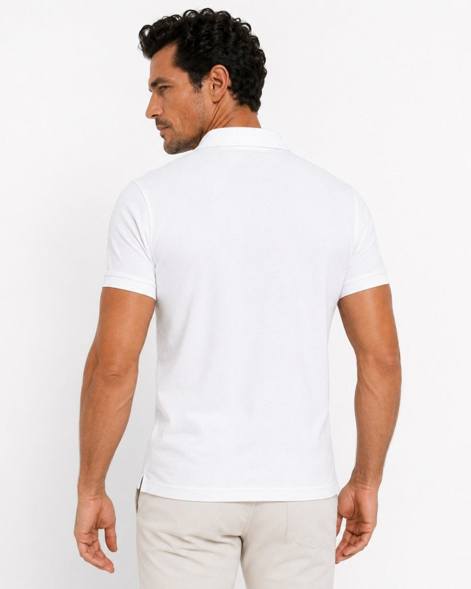 Man wearing a white t-shirt on a plain background