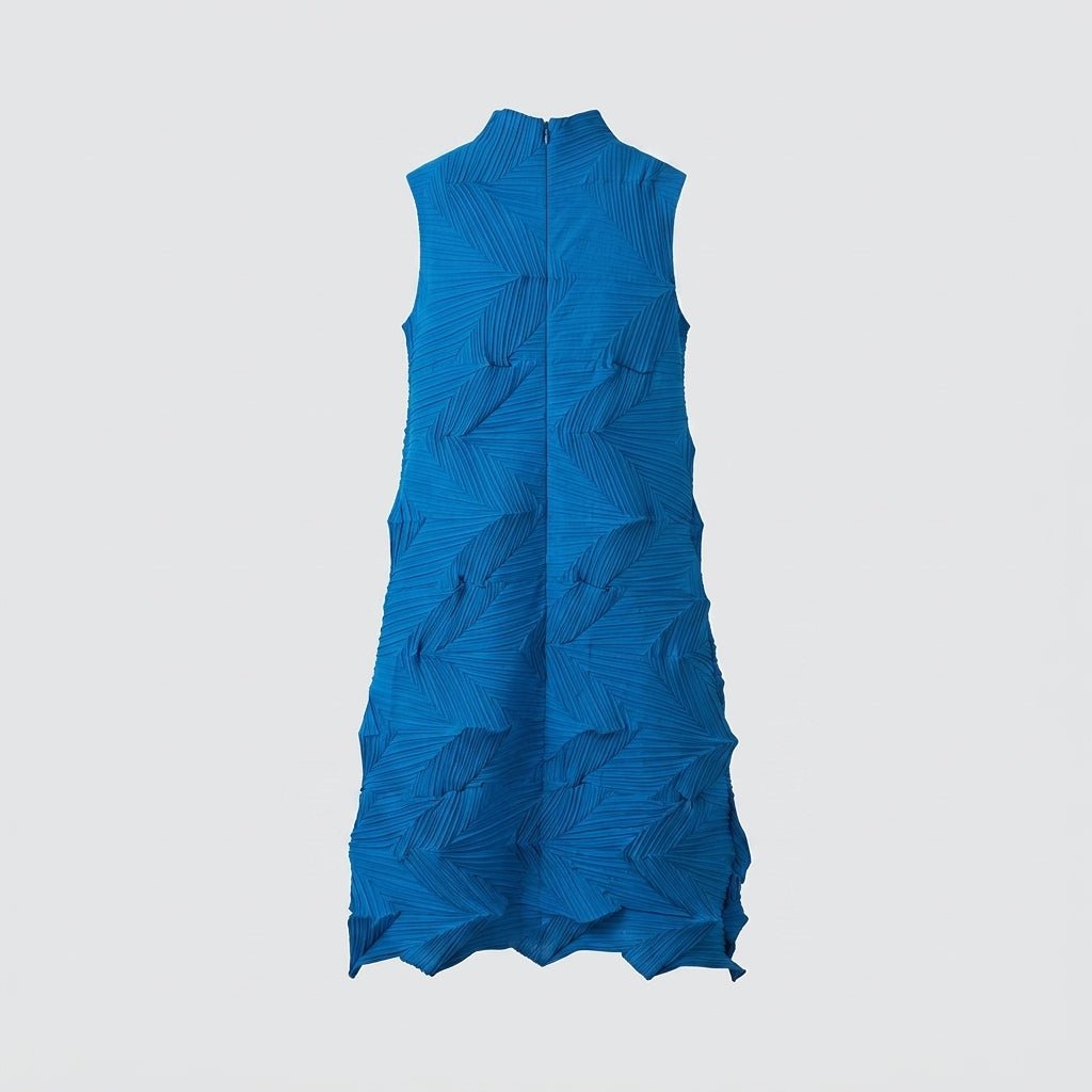  Studio flatlay of the front of the cobalt blue 3D geometric pleated mock neck midi dress.