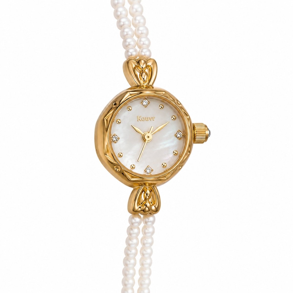 Close up detail of the Kouvr dainty women's watch showing the delicate gold hands and natural pearl strap.