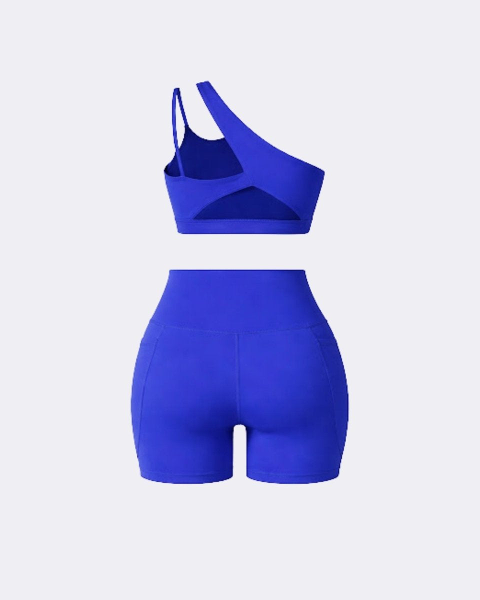 Ghost mannequin back view of dark blue two piece workout set detailing back cutouts and high waisted seam construction