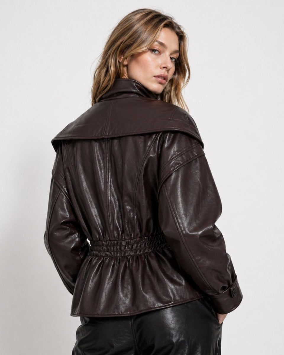 Back view of brown faux leather outerwear showing smocked elastic waist detailing.