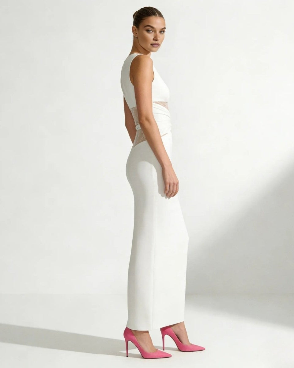 Side profile of a model showcasing the voluminous wide sleeve and boxy fit of the Deborah white knit sweater.