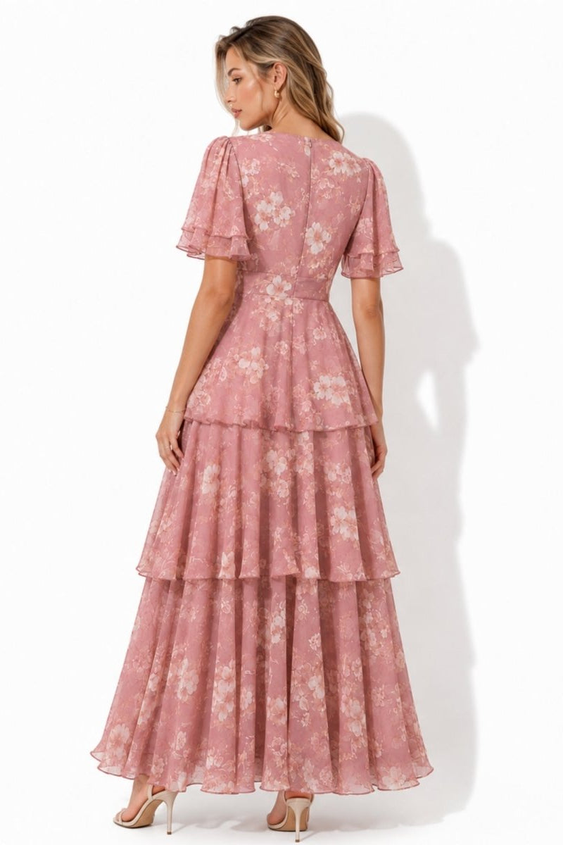 Back view of elegant pink floral v-neck flowing evening gown