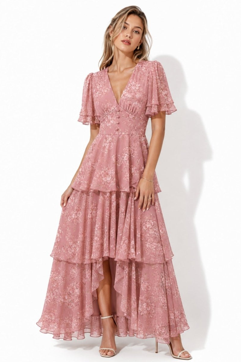 Dusty rose pink tiered floral maxi dress with flutter sleeves and asymmetrical hem by Kouvr