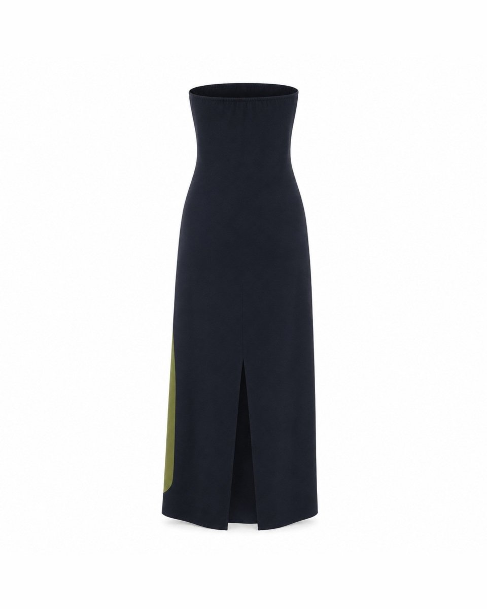 A dark navy blue strapless midi skirt with a high-waisted, fitted silhouette, a front slit, and a contrasting olive green panel on the lower left side, shown against a plain white background.