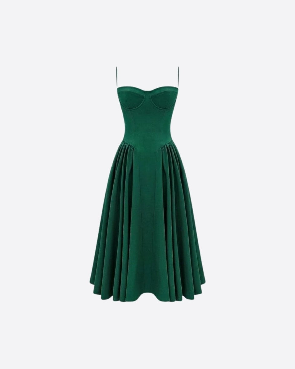 Studio product shot of an emerald green corset midi dress with a structured bustier top and pleated A-line skirt on a white background.