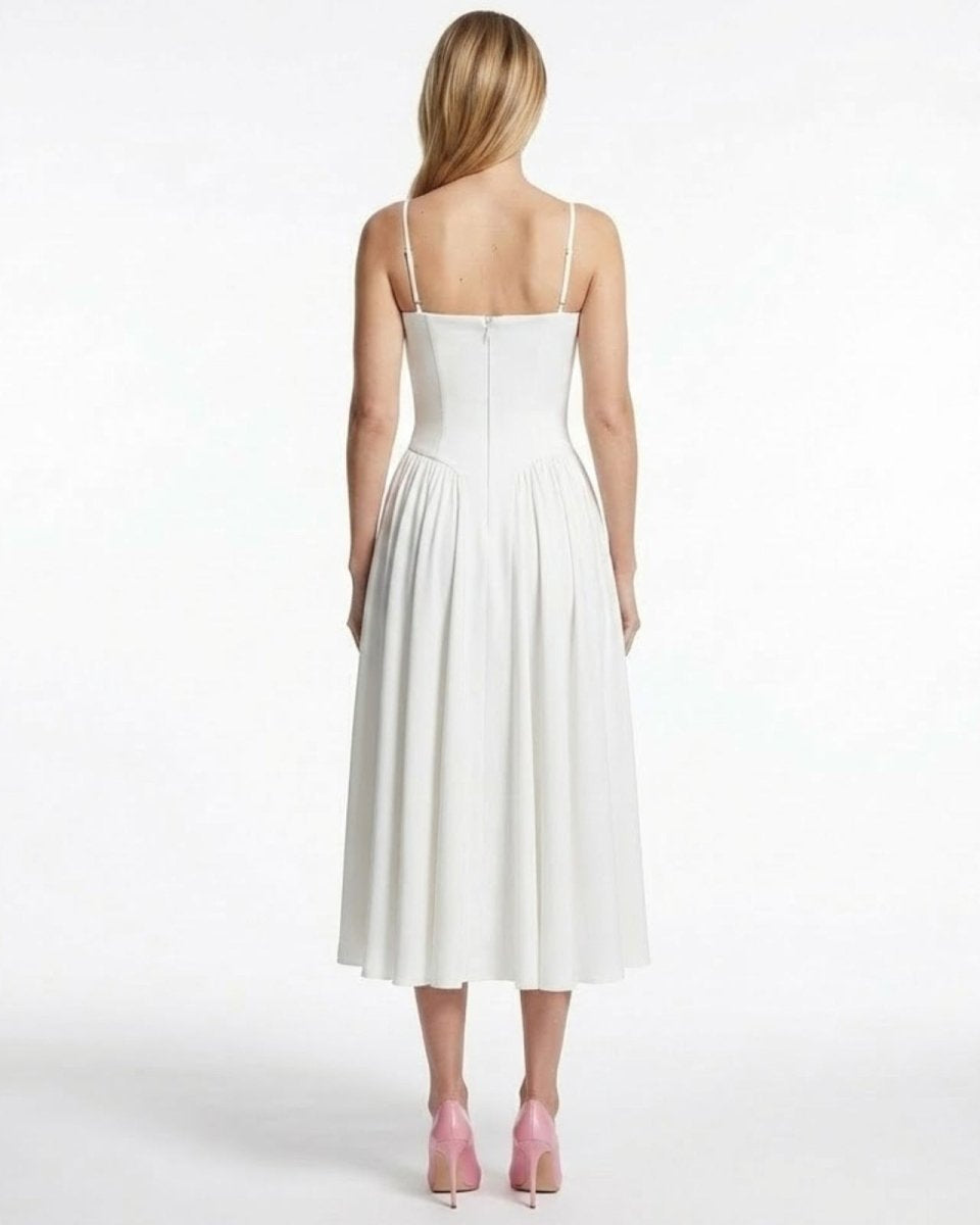 Back view of the Evdokia white bustier dress, displaying the spaghetti straps and concealed zipper detail.
