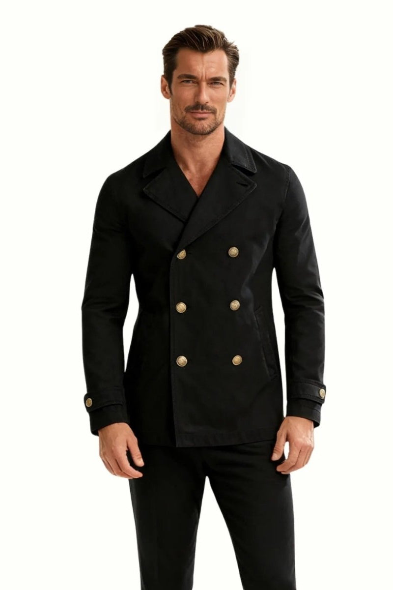 Man wearing the  black double-breasted cotton pea coat with gold buttons, showing the full front view and slim fit. 