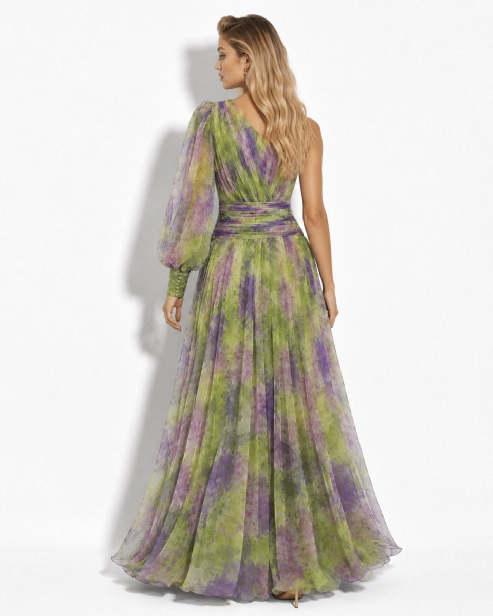 Woman wearing a green and purple tie-dye dress on a white background
