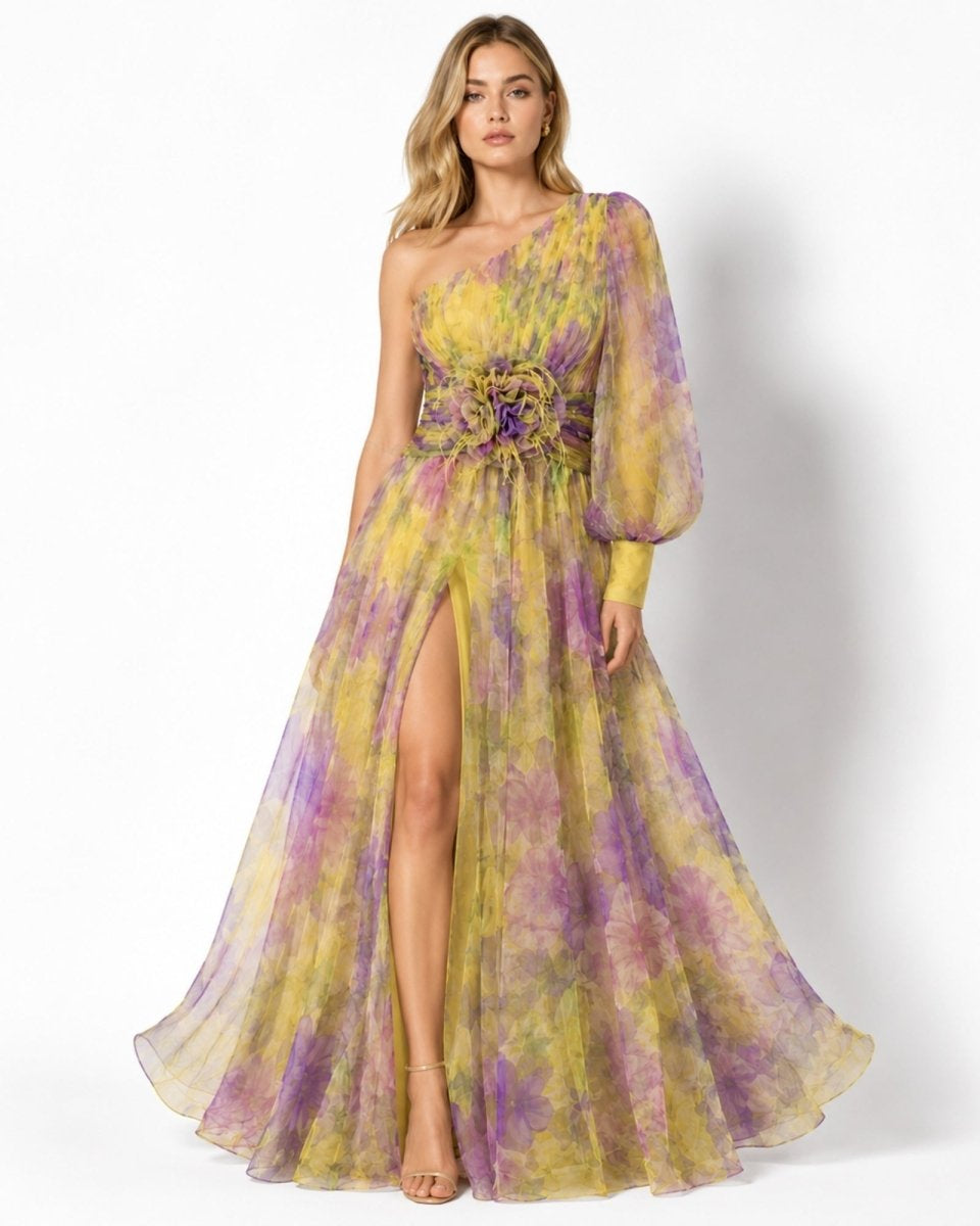 Woman wearing a yellow and purple floral dress on a white background