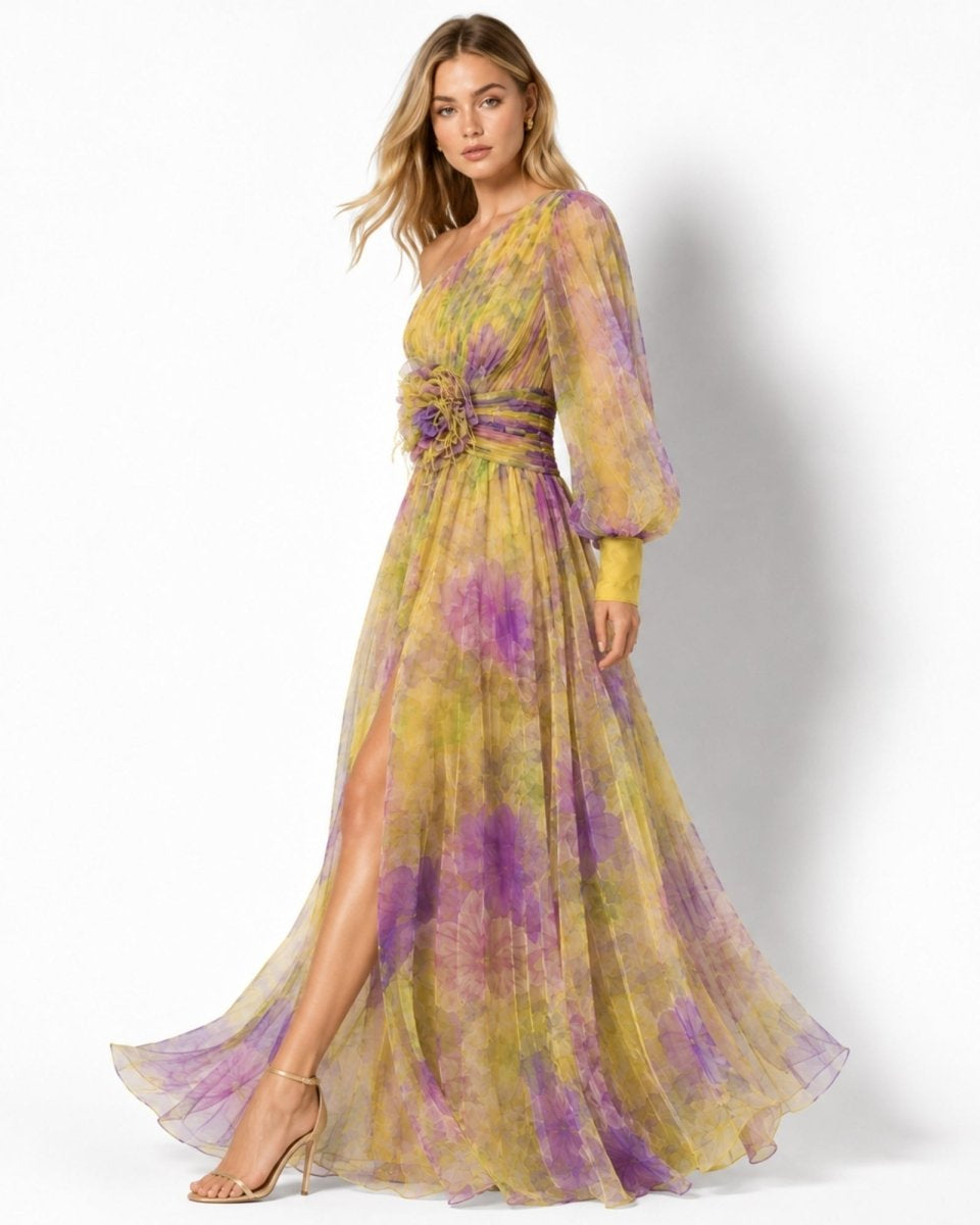 Woman wearing a yellow and purple floral dress on a white background