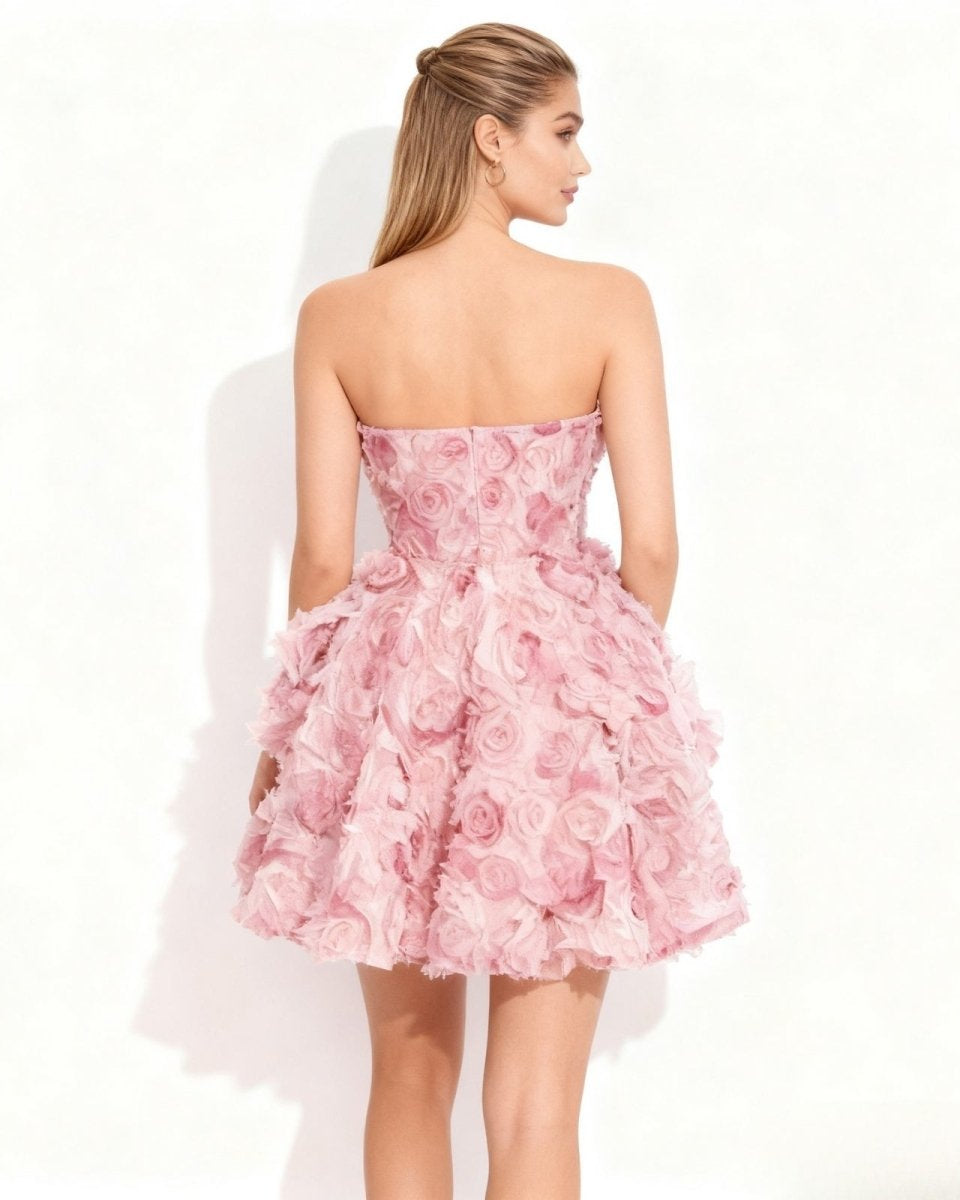 Back view of the Fenlo Form strapless pink rosette dress showing the concealed zipper.