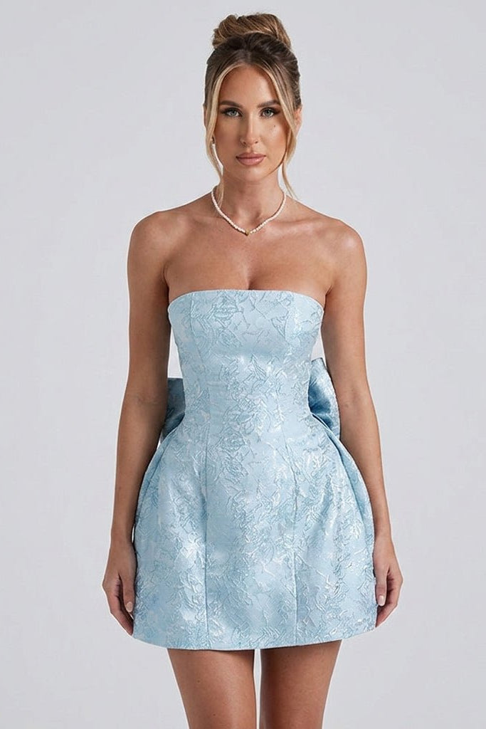 Side view of the light blue floral brocade party dress highlighting the voluminous A-line skirt and textured shimmering fabric.