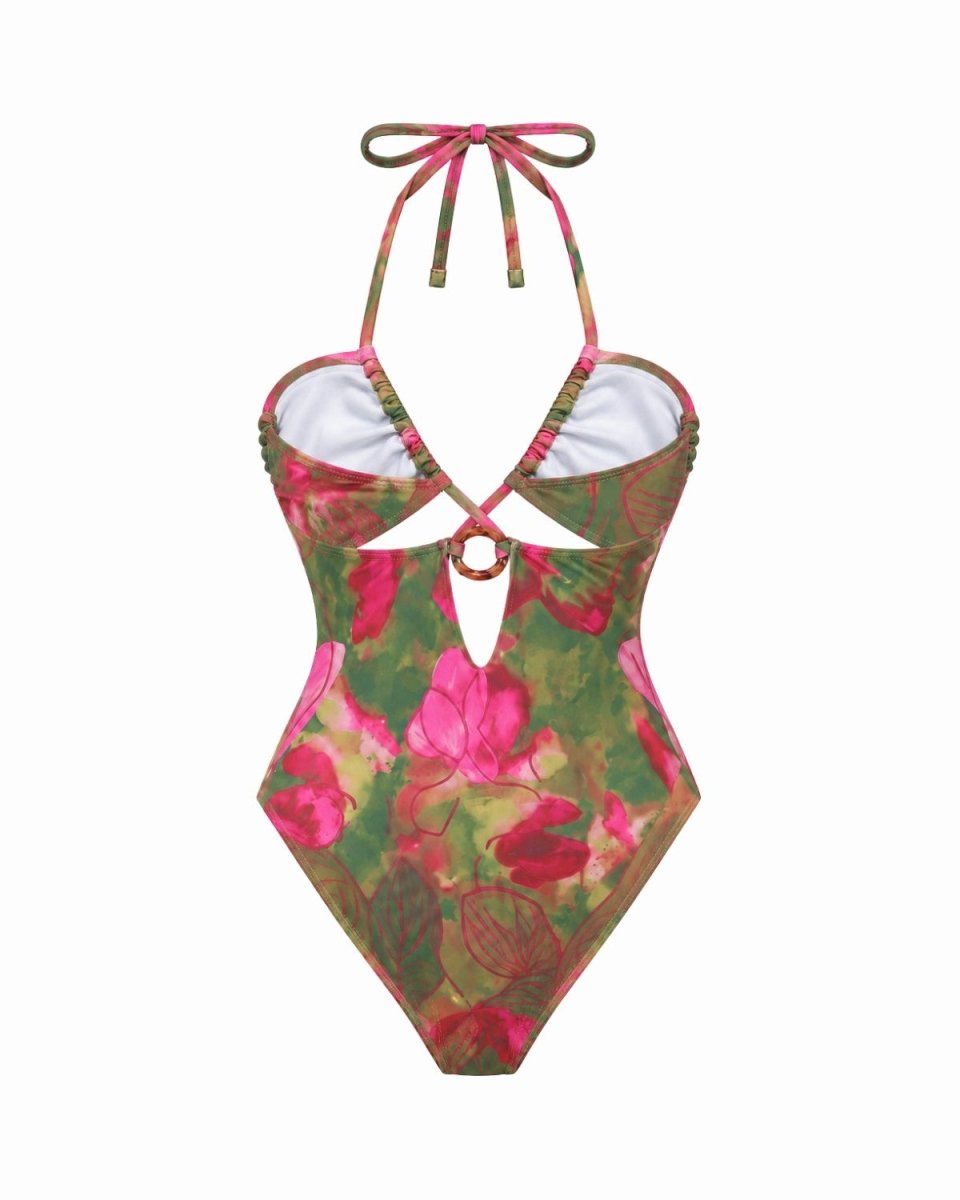 Front product view of green and magenta botanical print cutout swimsuit with tortoiseshell ring detail