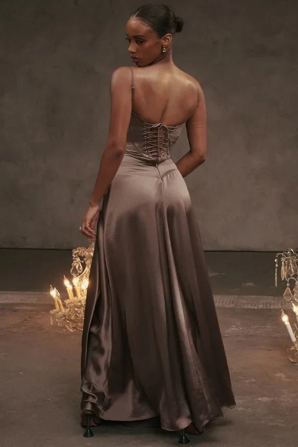 Gabriella Gown in Mocha: a brown satin corset maxi dress with a lace-up back, worn by a model.