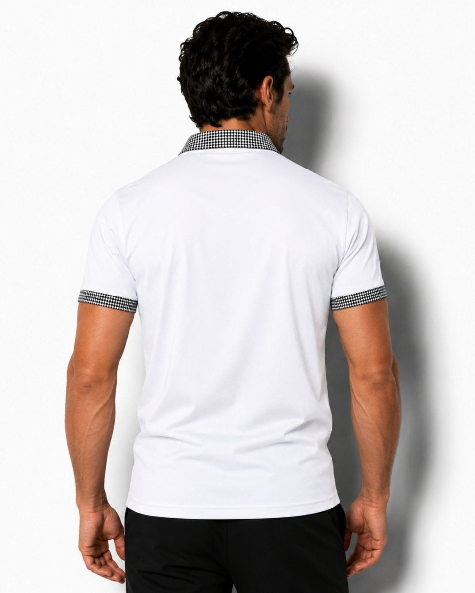 Man wearing a white polo shirt with black and white checkered trim on a white background