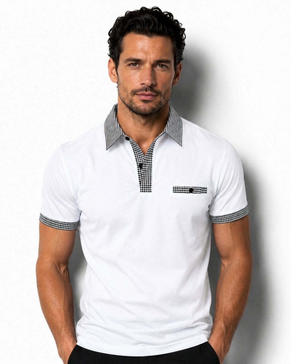Man wearing a white polo shirt with checkered details on a white background