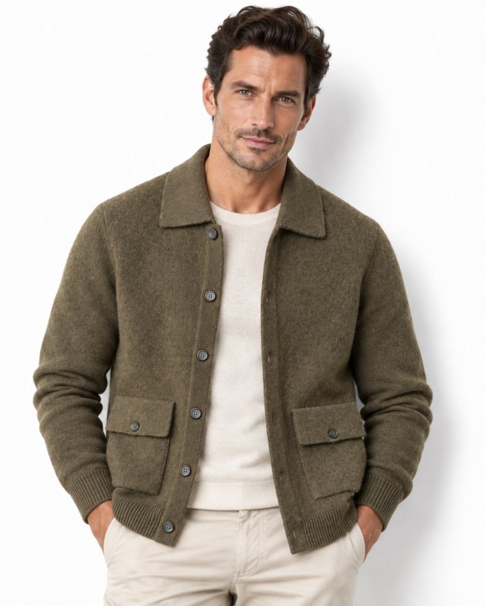 Front view of a male model wearing the luxury olive green knit collared sweater jacket over a white t-shirt.