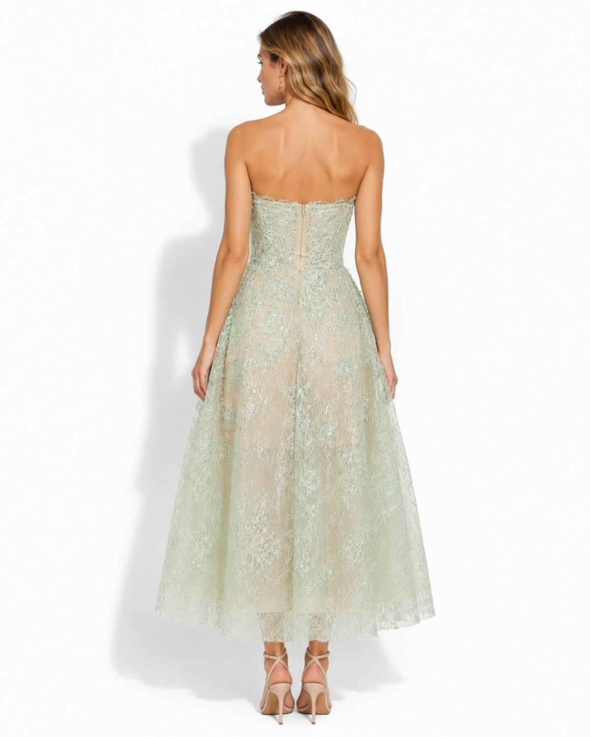 Side and back angle view of ethereal mint green sheer lace A-line midi dress showing structured bodice and flowing tea-length skirt.