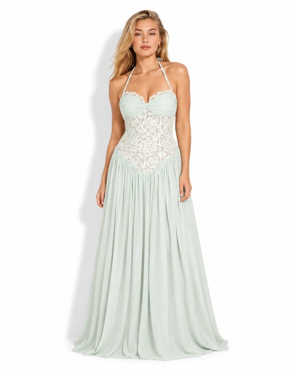Front view of a woman wearing the mint green lace corset pleated chiffon maxi dress with a halter neckline.