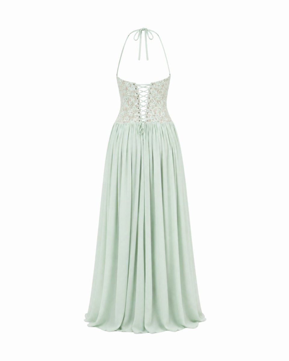 A mint green halter-neck maxi dress with a lace-up corset bodice and a flowing chiffon skirt, shown against a plain white background.