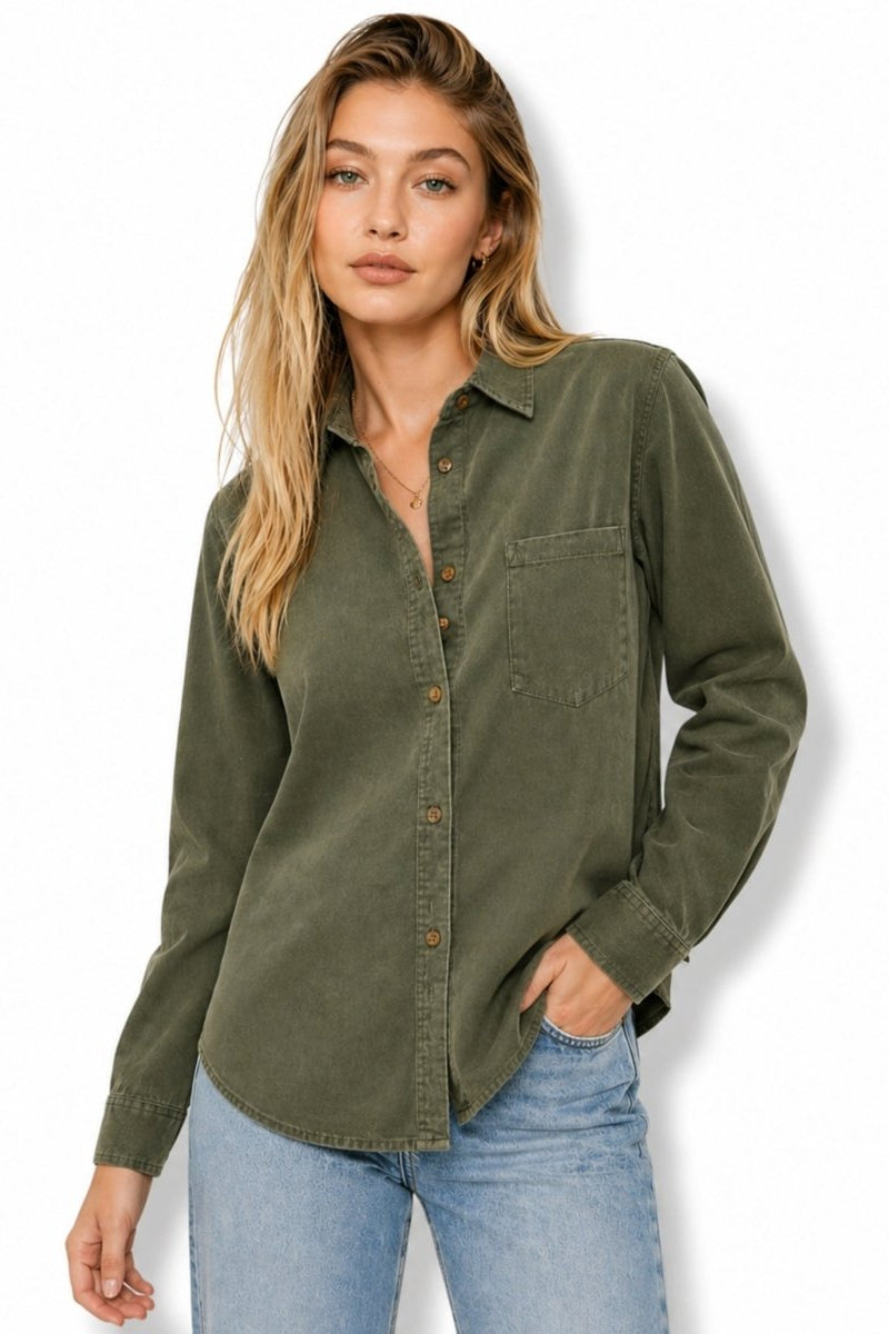 Woman wearing a premium green long sleeve button down shirt by Fenlo Form front view