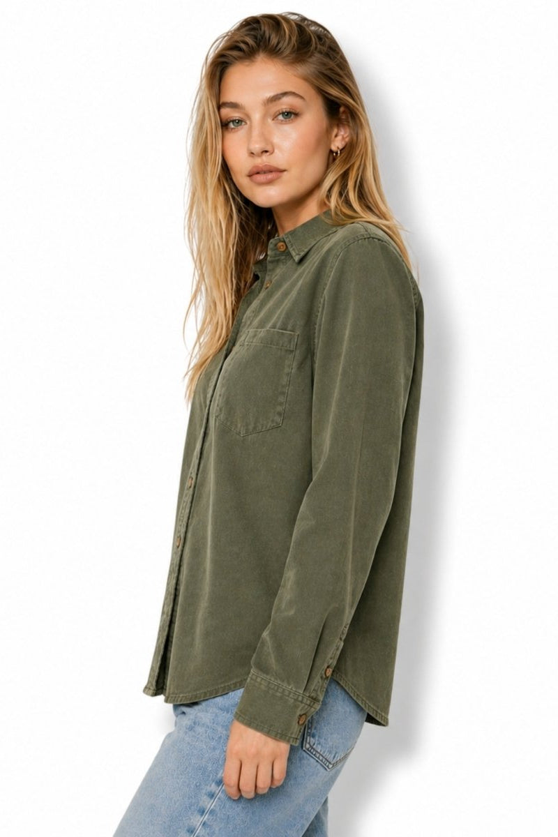Side profile of a woman modeling a relaxed fit green utility blouse