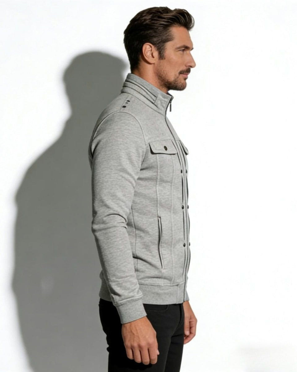 Side view of a man wearing the structured cotton jacket, showing the slim fit silhouette and arm details.