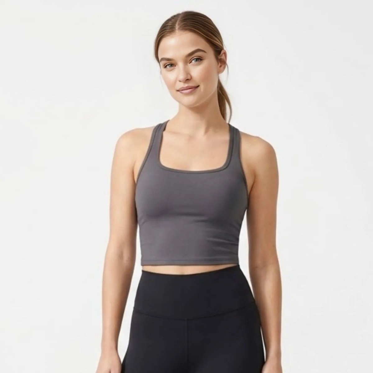Women's charcoal grey seamless racerback athletic crop top front view.