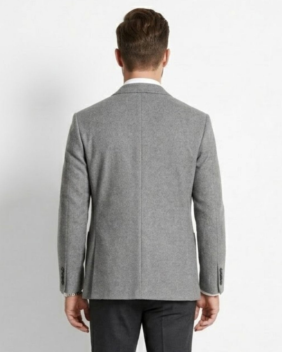 Gray blazer worn by a person on a white background