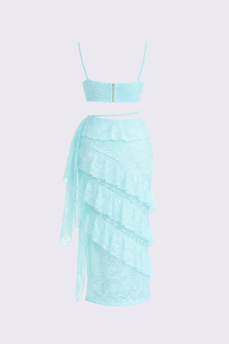 Mint green two-piece set with a top and skirt on a light purple background