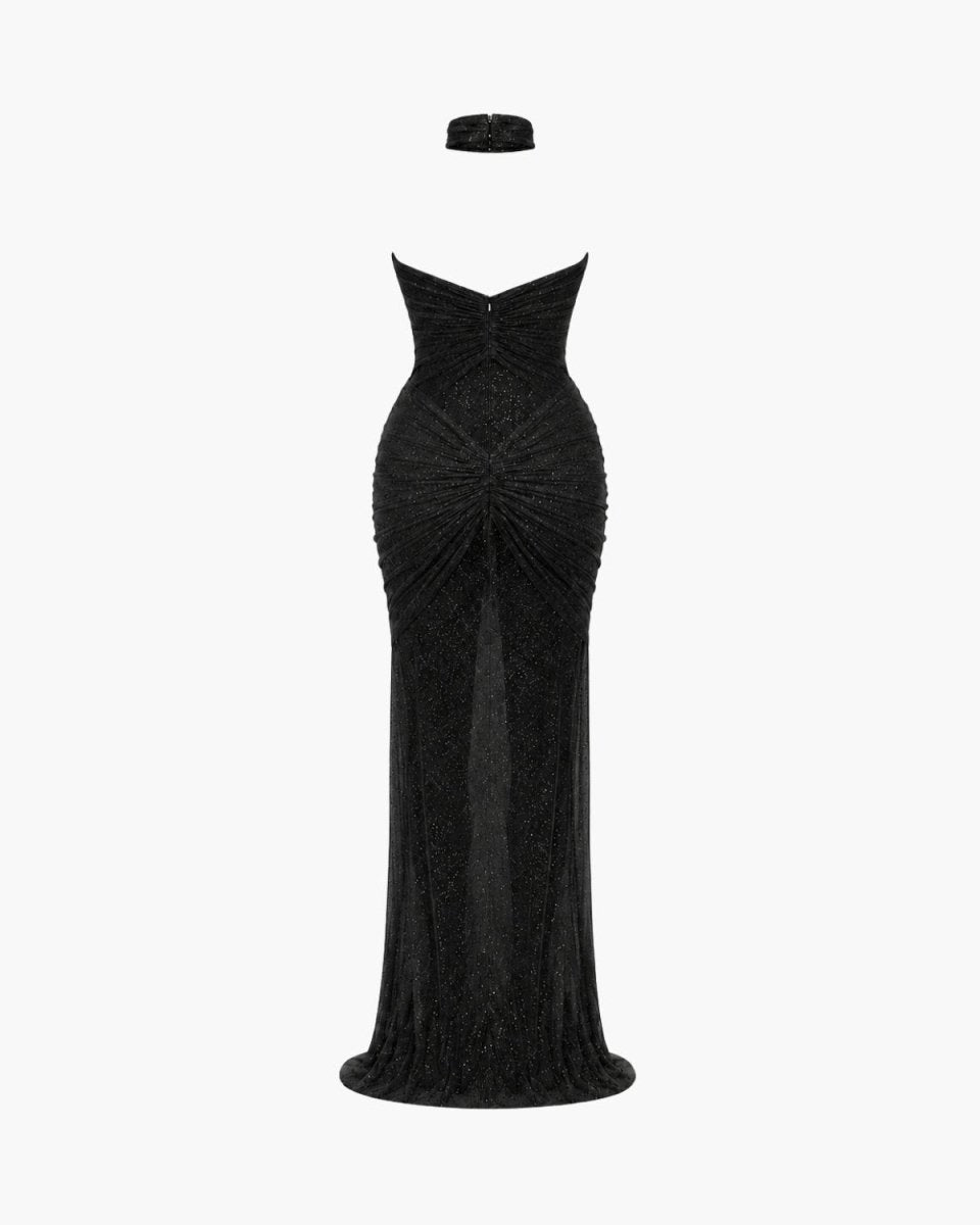 A strapless black evening gown with a sweetheart neckline, ruched bodice, and a matching black headpiece, displayed on a white background.