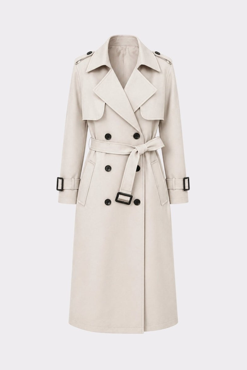 Front detail product shot of a ivory double breasted trench coat showing contrasting dark buttons, notched lapels, and adjustable buckle belt.