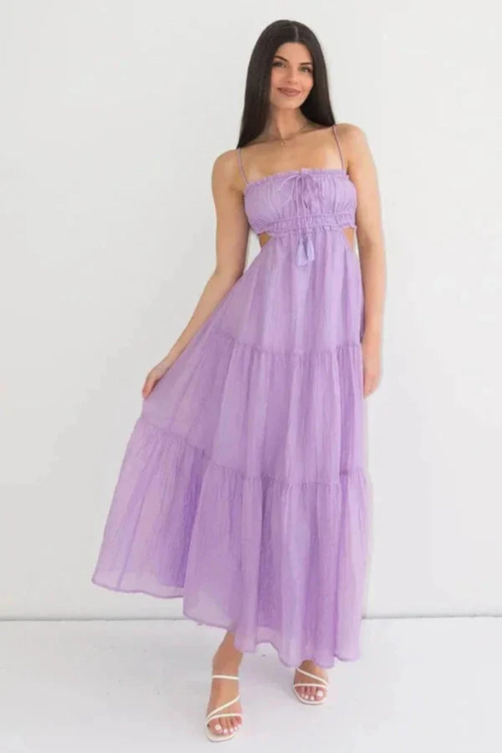 Model wearing the Amelia lavender tiered cutout maxi dress by Kouvr, front view.