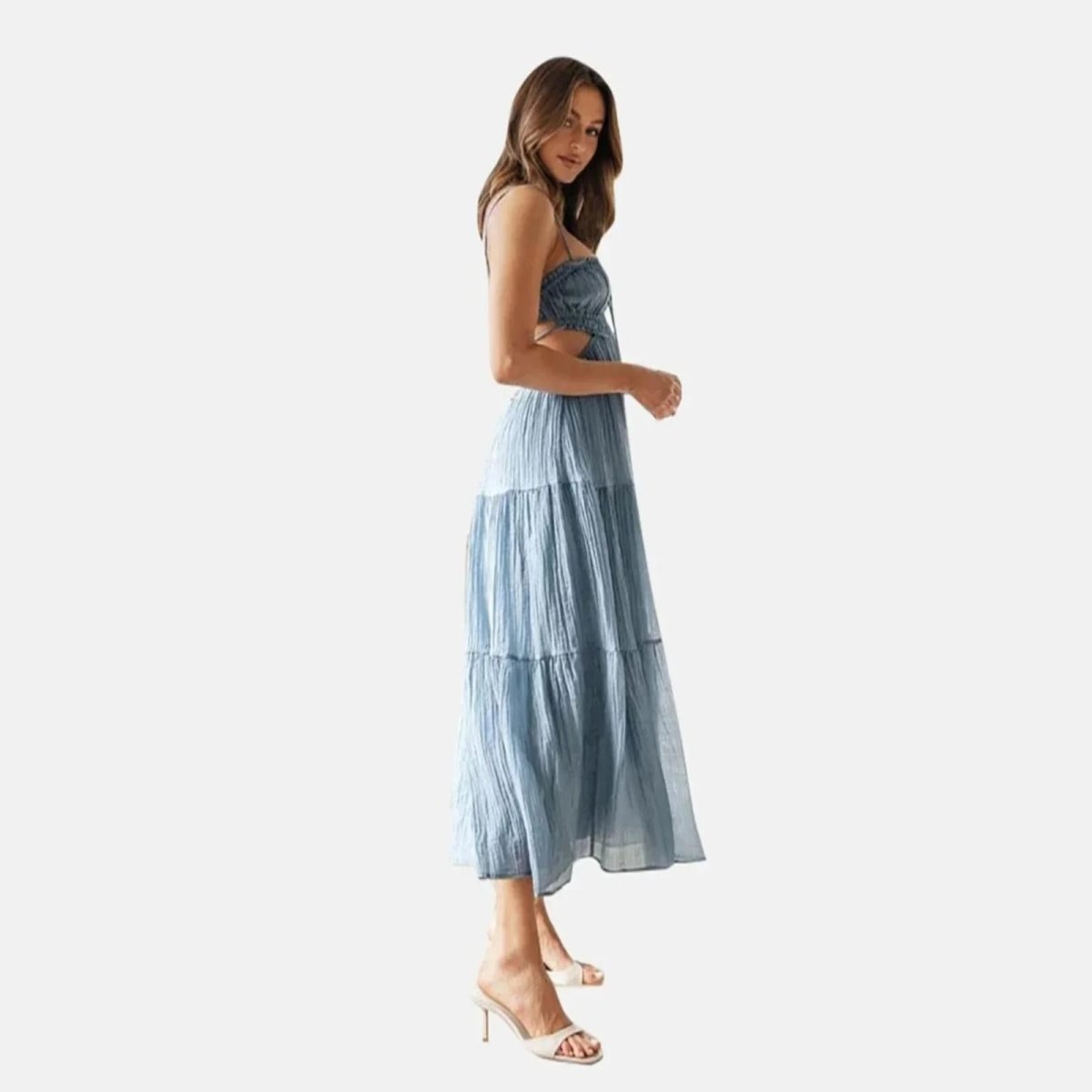 Side view of the Amelia sky blue cutout dress, highlighting the crinkle cotton texture.