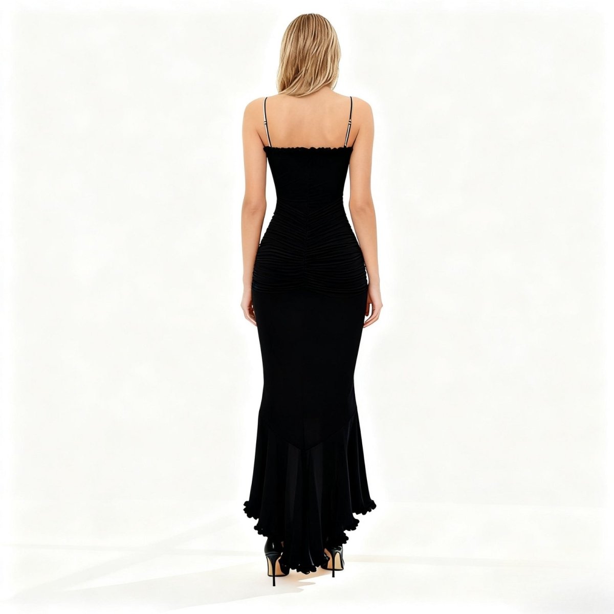 Black kouvr evening gown with a fitted bodice and flared skirt on a white background