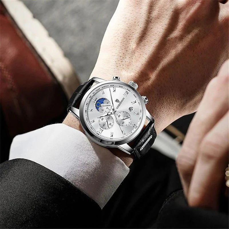 Close-up of the Kouvr Dexter Chronograph watch with black dial and leather strap on a man's wrist, showing its scale and fit. 
