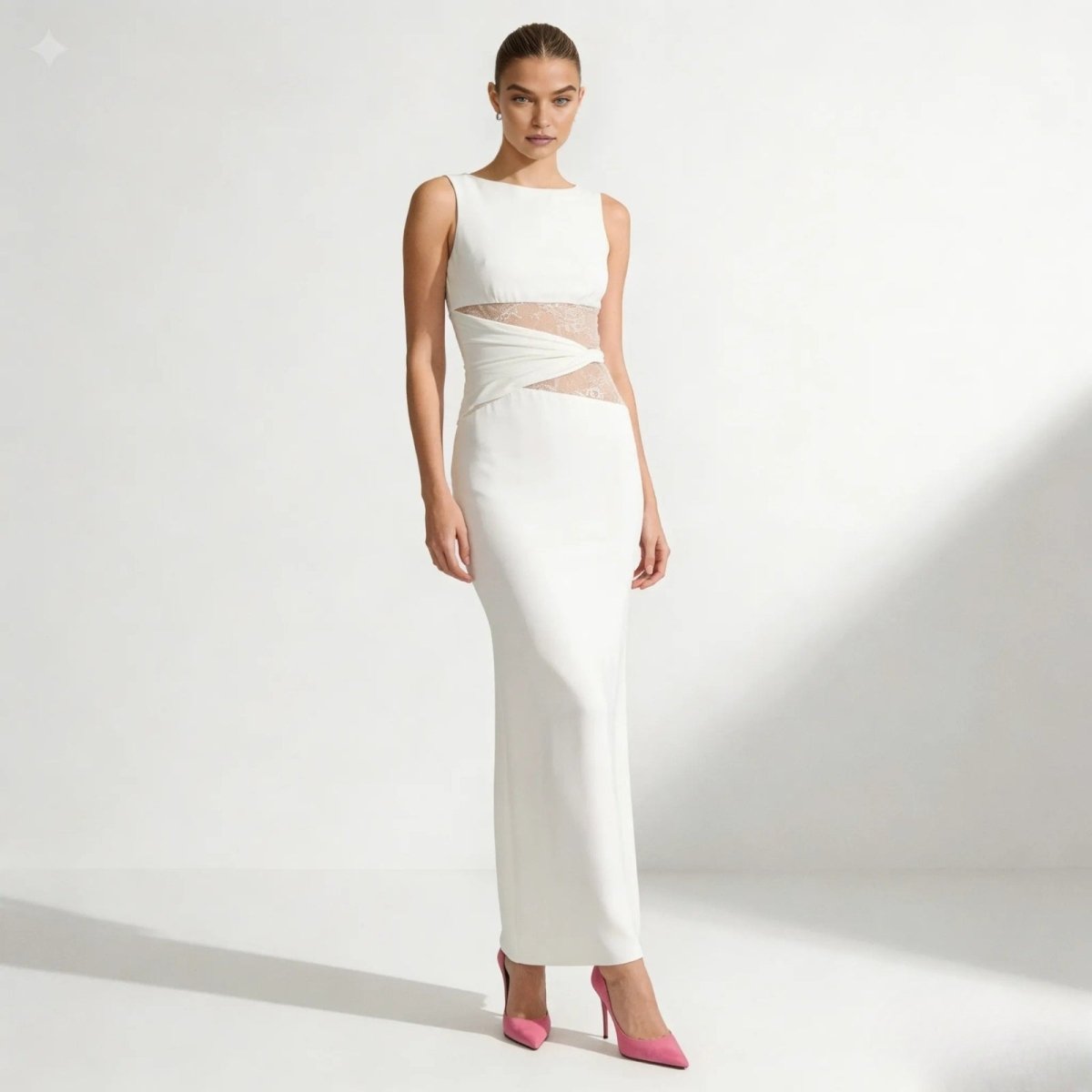 Model wearing the Kouvr Fashion Deborah oversized white sweater with wide sleeves, paired with black pants, against a white background.
