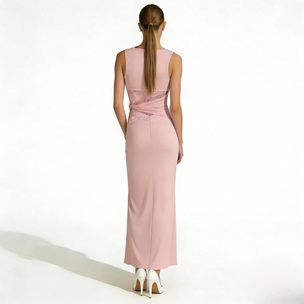 Back view of the Kouvr Fashion deborah pink long evening dress, showcasing the crossover lace detail at the waist and elegant open back.
 