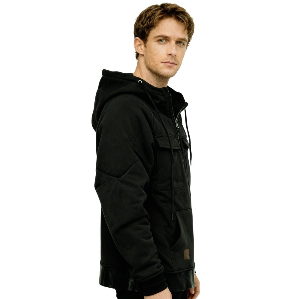 Model wearing the black Dominic tactical utility hoodie by Kouvr Fashion, front view.

