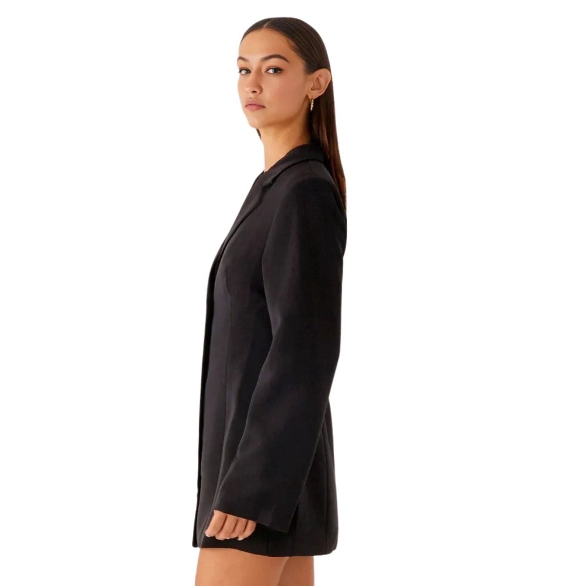 Side profile of a model in the Kouvr Fashion Eshara structured black tuxedo dress.