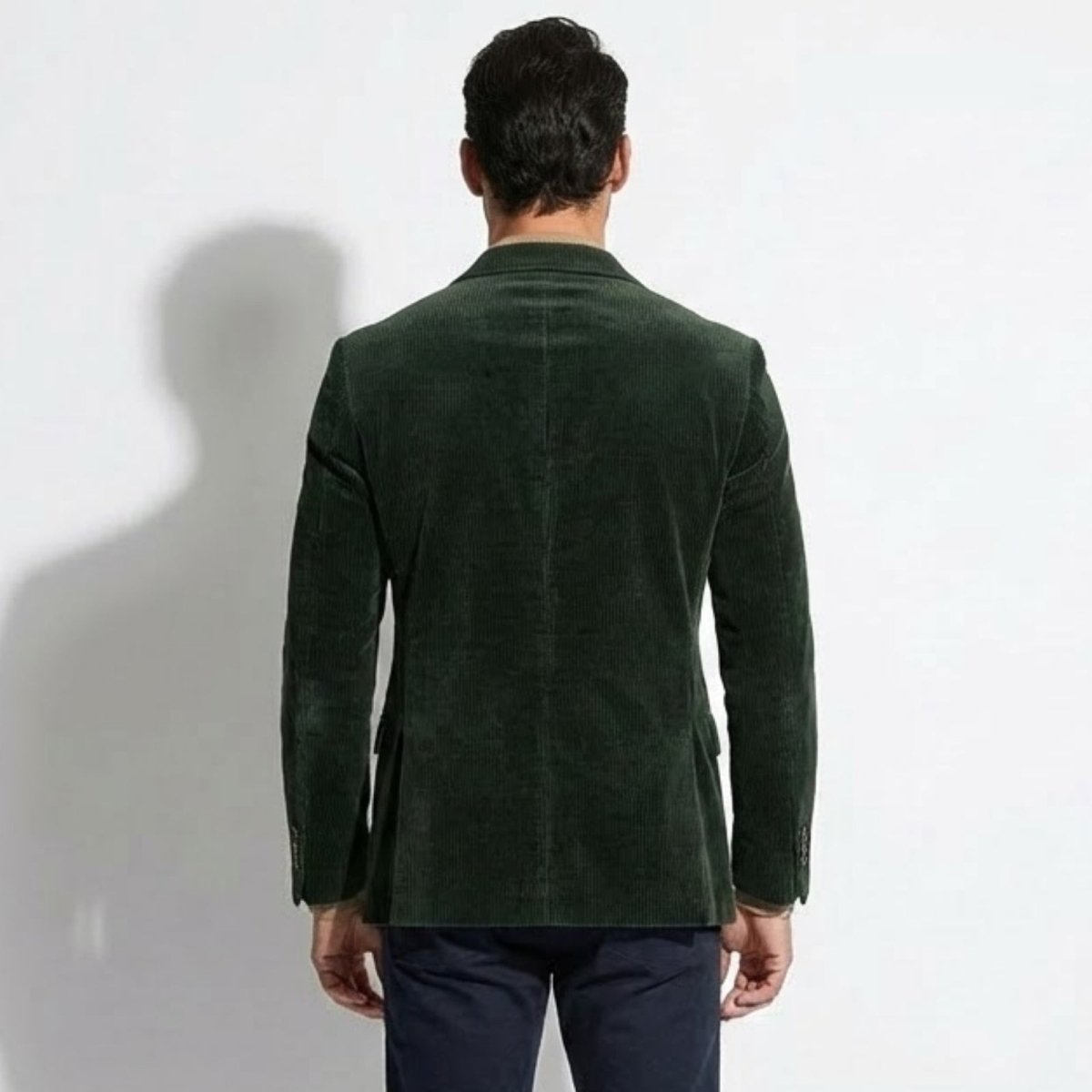 Back view of the Kouvr Fashion men's green grady blazer, showing the double vent detail and tailored fit across the shoulders.
