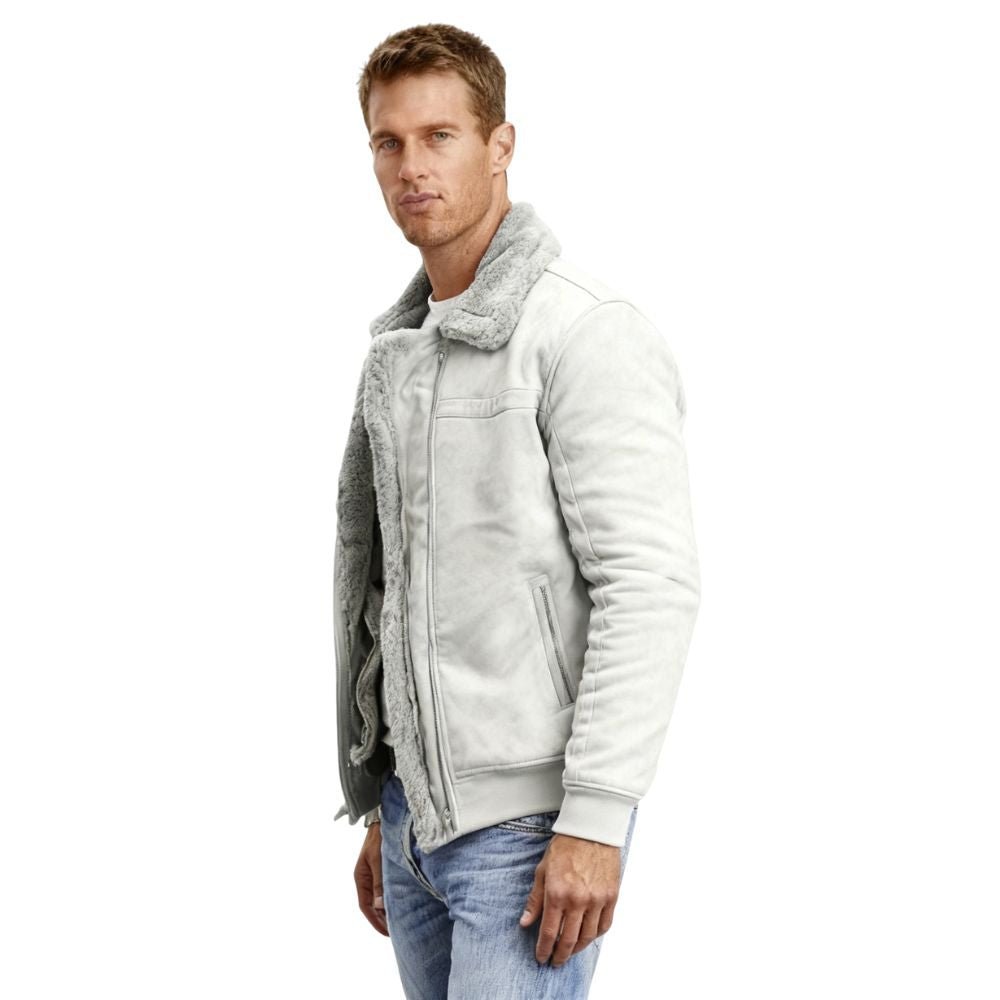 Man wearing a gray kouvr jacket with a fur-lined hood on a white background