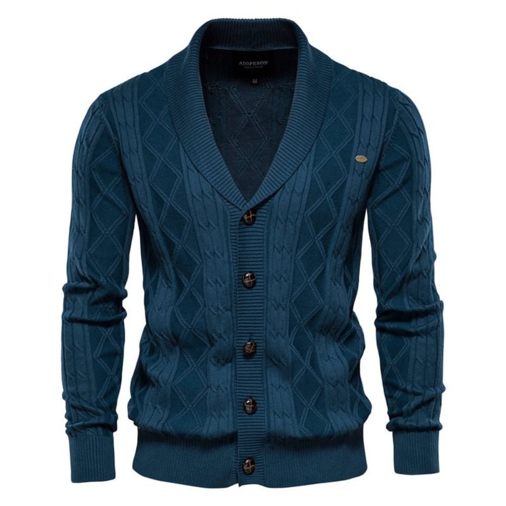 Blue kouvr  cable knit cardigan with button details on a white background