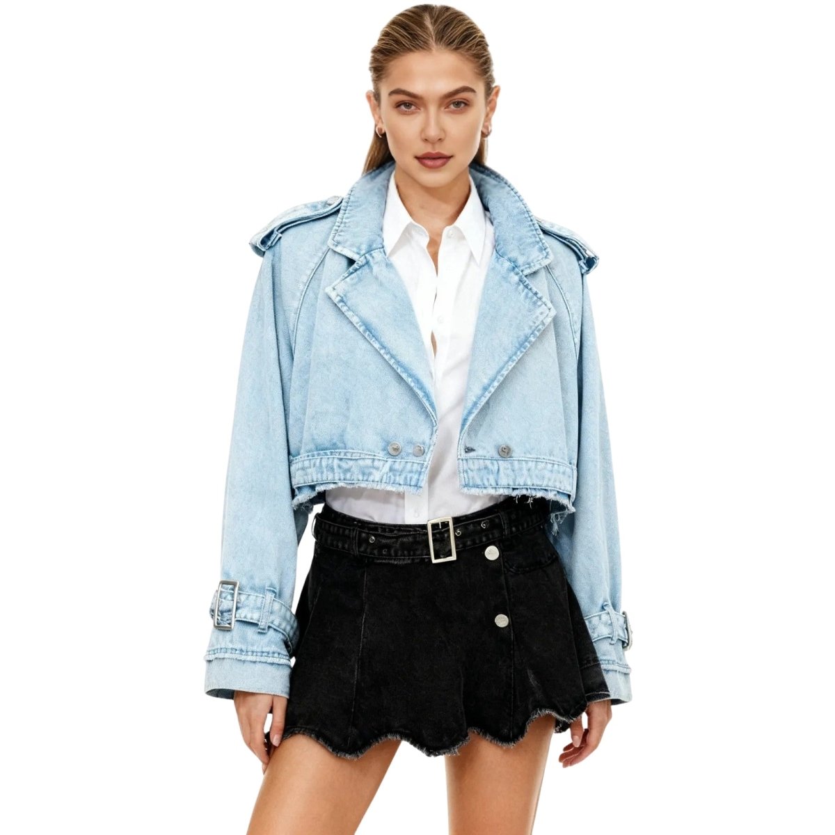 Woman wearing a light blue kouvr denim jacket over a white shirt and black skirt on a white background